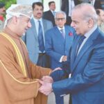 Omani Ambassador Fahad Sulaiman Khalaf Al Kharusi shakes hands with PM Shehbaz Sharif.—APP